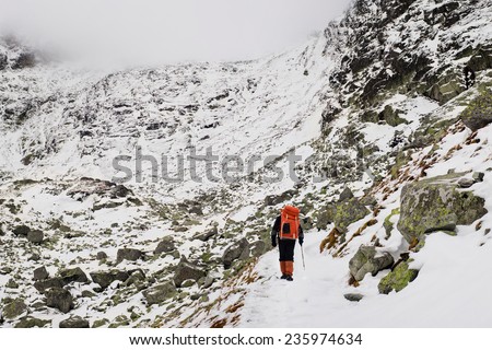 Alpinist climbing on mountain route up to peak in High Tatras. Slovakia. Poland. High Tatras