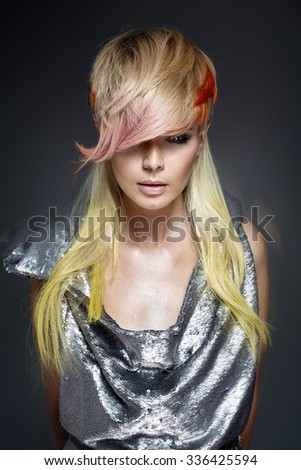 Fashion model with modern colorful hair
