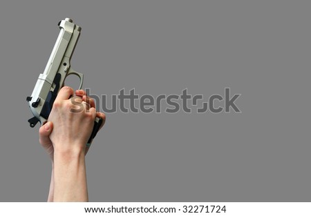 isolated gun in hand on gray background