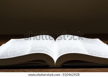 holy bible on wooden table