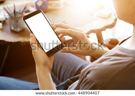man using mobile smart phone with blank white screen