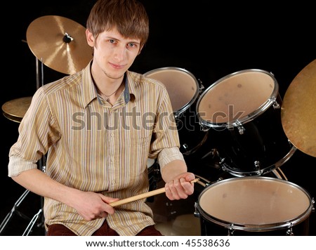 young musician beat the drums