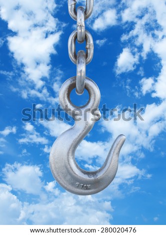 Metal crane hook hanging on chain
