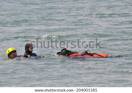 MOLVENO LAKE, TRENTINO ITALY - JUNE 21, 2014: Emergency simulation on a beach