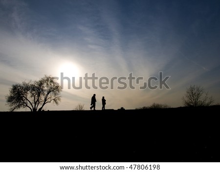 Sunset with walking people in shadow