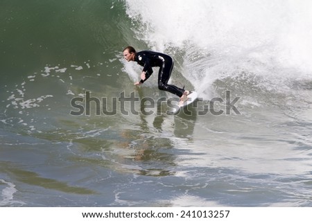 PEOPLE SURFING IN THE OCEAN, SAN DIEGO USA - SEPTEMBER 1st, 2014: People in San Diego surfing. San Diego is very good for surfing