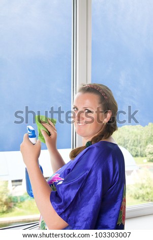 Nice girl washes window