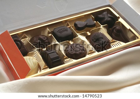 box of chocolate sweets on white background