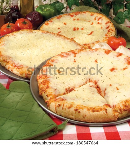 Assorted Round, Thick Pizza Pies in Intimate Italian Service Setting