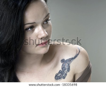 girl tattoos on shoulder. stock photo : Girl with tattoo