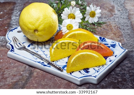 Colorful fruit jelly with lemon on decorative tray