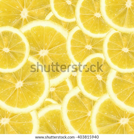 A slices of fresh yellow lemon texture background pattern. Lemon pieces in different sizes background. Texture formed by lemons.