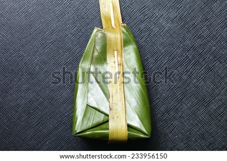 Khanom Sod Sai or steamed flour with coconut filling Thai traditional style ready to serve with banana leaf packaging represent Thai traditional and vintage confectionery and dessert.