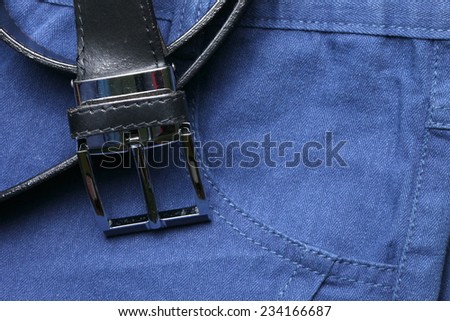 Blue color of short trouser made from herringbone patterned fabric style represent the applied synthetic cloth production in the scene appear the black color leather belt business style  also