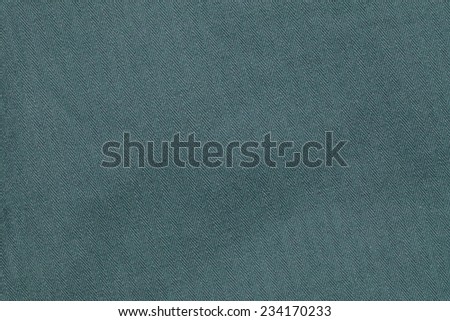 Close up photo of green color filtered herringbone patterned fabric style represent the applied synthetic cloth production.