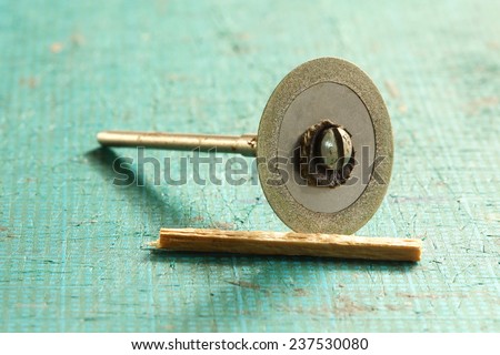 Small size of diamond cutting blade put beside balsa wood represent the model maker tools and material for hobby and model making.