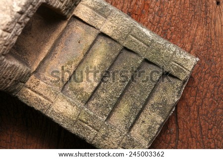 Old and vintage surface texture of sand stone pavilion stair architectural sculpture model with moss stain represent the texture and surface background.