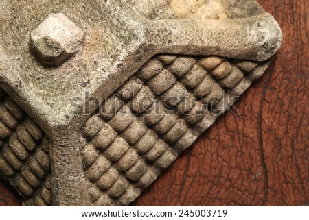 Old and vintage surface texture of sand stone pavilion roof architectural sculpture model with moss stain represent the texture and surface background.