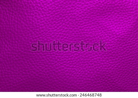 Close up photo of violet color filtered leather surface texture style represent the surface background.