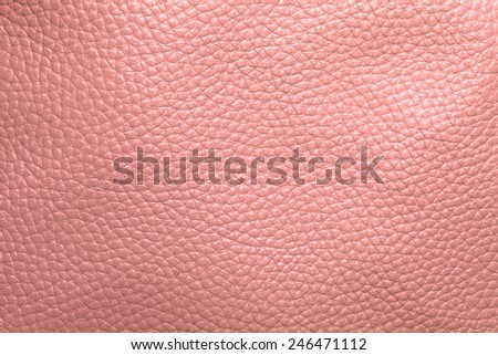 Close up photo of pink  color filtered leather surface texture style represent the surface background.