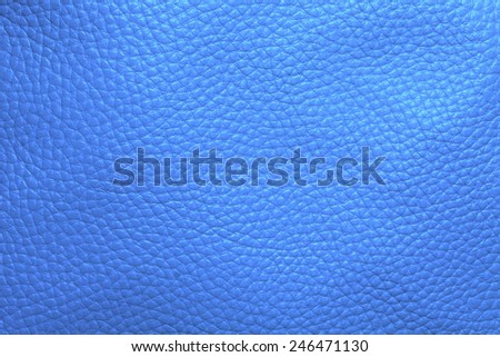 Close up photo of light blue color filtered leather surface texture style represent the surface background.