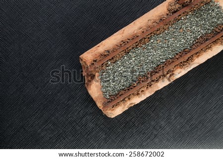 Model railway track scratch built on rusty look on railway with diorama on the black color leather background represent the model making concept idea related.