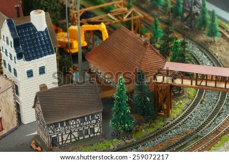 Vintage and classic miniature model railway layout in glass cabinet represent the model railway related idea concept.