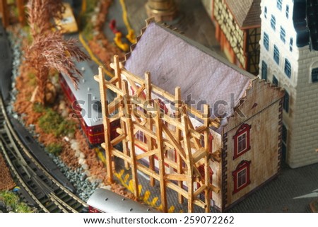 Vintage and classic miniature model railway layout in glass cabinet represent the model railway related idea concept.
