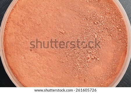 Laterite or red earth soil in very small size represent a material for model railroad making technique represent the shape and texture surface background concept related idea.