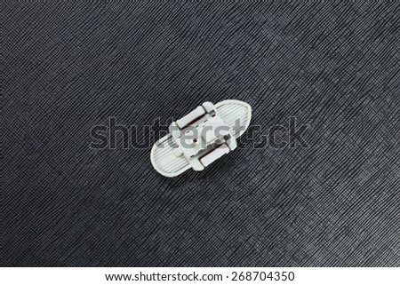 The miniature of retro plastic steam ship toy model represent the ship and water transportation concept related idea.