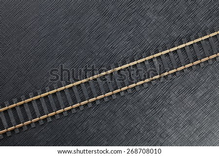 Vintage and classic miniature plastic model railway track represent the model railway and model making related idea concept.