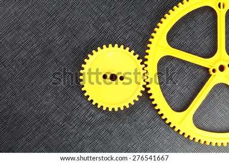 The yellow color plastic gear represent the mechanism concept related idea.