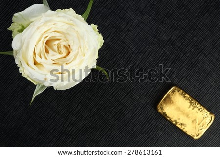White rose and gold represent the flower and business concept related idea.
