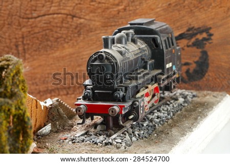 Vintage and classic miniature model railway scene appear the German locomotive represent the model railway concept related idea. Super macro shot and intention focus at the locomotive.