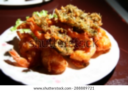 Blurry focus of food on the food table scene represent the food background concept related idea.