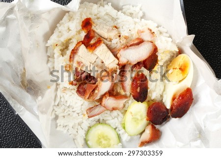 Barbecued red pork in sauce with rice on paper packaging represent the paper packaging for food concept related idea.