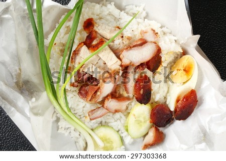 Barbecued red pork in sauce with rice on paper packaging represent the paper packaging for food concept related idea.