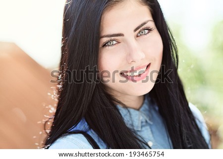 wonderful smile of a beautiful girl on a sunny afternoon
