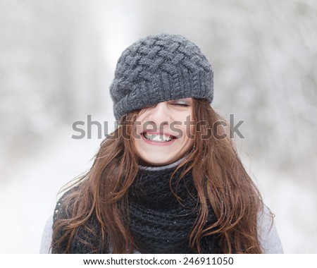 beautiful brunette girl in winter hat hipster