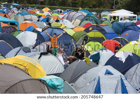 NOVI SAD,SERBIA-JULY 11th,2014:Campsite of famous EXIT music festival with group of young people waving to the camera on July 11th 2014, Novi Sad, Republic of Serbia