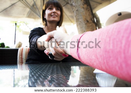 Handshake of a two businesswomen after closed deal