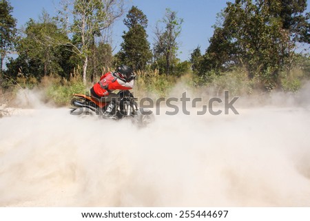 CHIANG MAI, THAILAND - FEBRUARY 8 : Tourists riding ATV to nature adventure on dirt track on FEBRUARY 8, 2014 in Chiang Mai, Thailand.