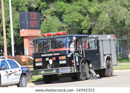 TOPEKA, KS - JULY 10: The Topeka police S.W.A.T. and Hostage Rescue teams respond to a home where a man barricaded himself in his home, threatening harm to himself on July 10, 2010 in Topeka, KS.