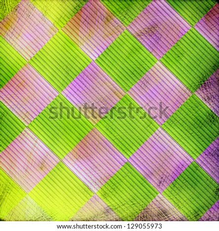 Pink and green distressed harlequin patterned abstract background with grunge feel for mardi gras mardigras fat Tuesday and also jester circus clown background