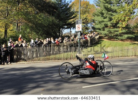 NEW YORK - NOV. 7:  An unidentified hand cyclist (wheeler) with a prosthetic leg cycles the last few miles of the 2010 New York City Marathon in Central Park on Nov. 7, 2010 in New York, NY