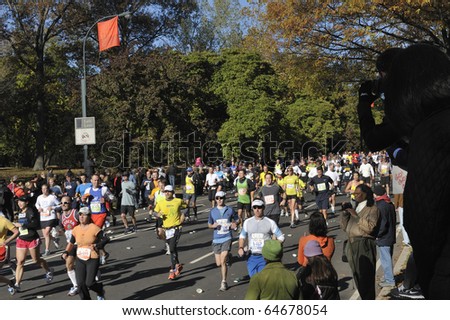 NEW YORK - NOV. 7:  A large wave of runners heads into the last few miles of the 2010 New York City Marathon just past Mile 24 in Central Park on Nov. 7, 2010 in New York, New York.