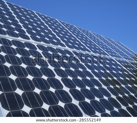 Solar panel photovoltaic cells array close up with blue sky copy space. Solar energy is an ecofriendly power source which uses the sun to generate clean renewable energy.