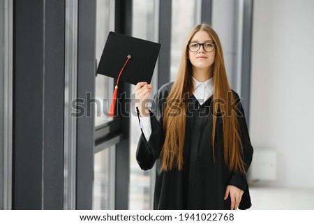 Woman portrait on her graduation day. University. Education, graduation and people concept.
