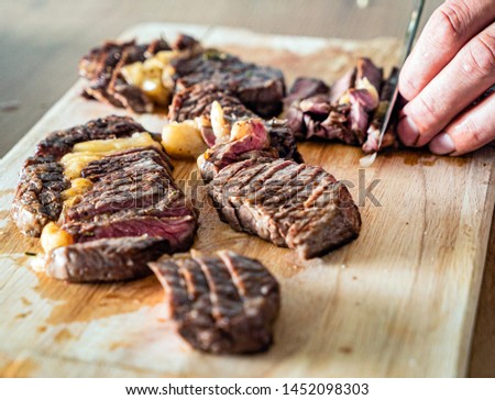 grilled steaks on the wooden board