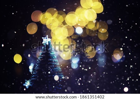 Christmas and New Year holiday background copy space. Winter holiday background with frozen fir, glitter lights, bokeh.